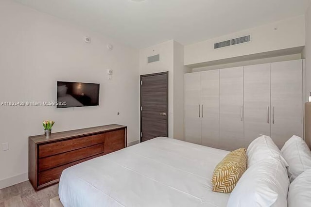 777 N Ocean Dr Unit N401, Hollywood, FL 33019 - bedroom with light wood finished floors and baseboards