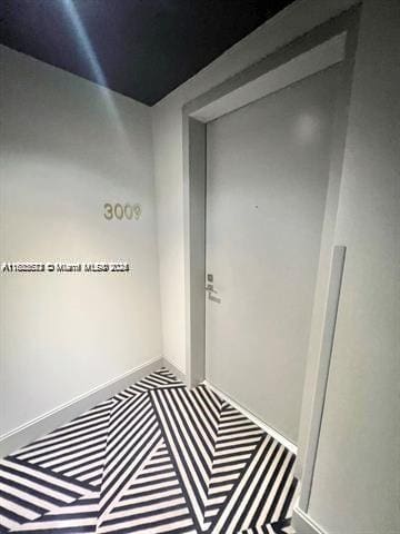 45 SW 9th St Unit 3009, Miami, FL 33130 - detailed view of carpet floors and baseboards