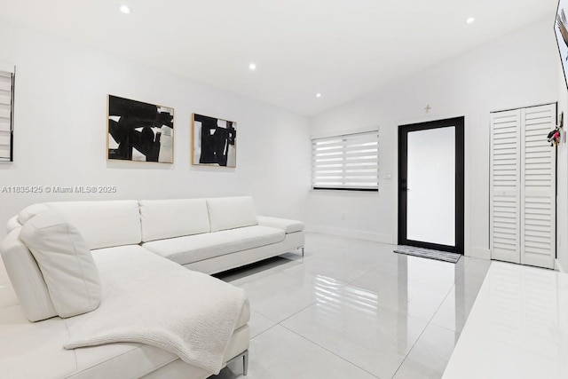 7029 W 29th Way, Hialeah, FL 33018 - living area featuring lofted ceiling, recessed lighting, and tile patterned floors