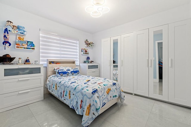 7029 W 29th Way, Hialeah, FL 33018 - bedroom with light tile patterned floors and a closet