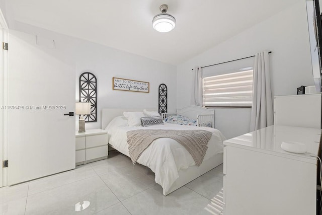7029 W 29th Way, Hialeah, FL 33018 - bedroom featuring lofted ceiling and light tile patterned floors