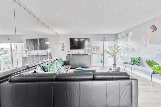 1890 W 56th St Unit 1411, Hialeah, FL 33012 - living area featuring a textured ceiling and wood finished floors