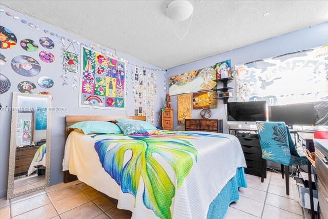 1890 W 56th St Unit 1411, Hialeah, FL 33012 - bedroom featuring tile patterned flooring, an office area, and a textured ceiling