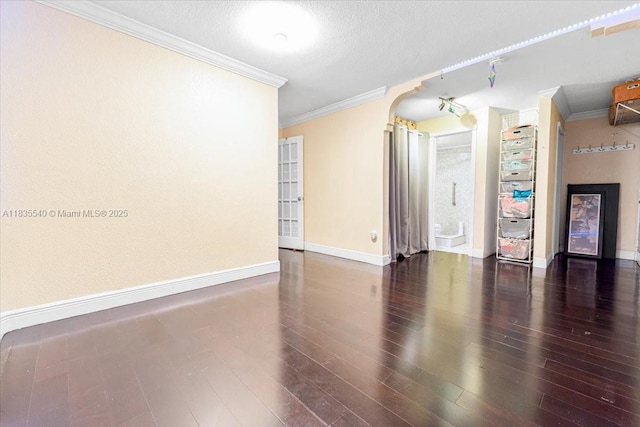 1890 W 56th St Unit 1411, Hialeah, FL 33012 - unfurnished room featuring arched walkways, ornamental molding, wood finished floors, and a textured ceiling
