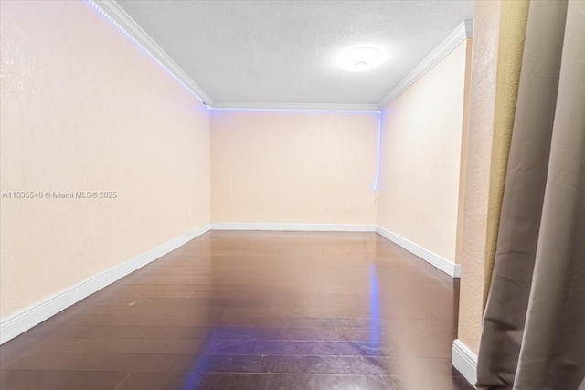 1890 W 56th St Unit 1411, Hialeah, FL 33012 - unfurnished room with crown molding, hardwood / wood-style flooring, and a textured ceiling