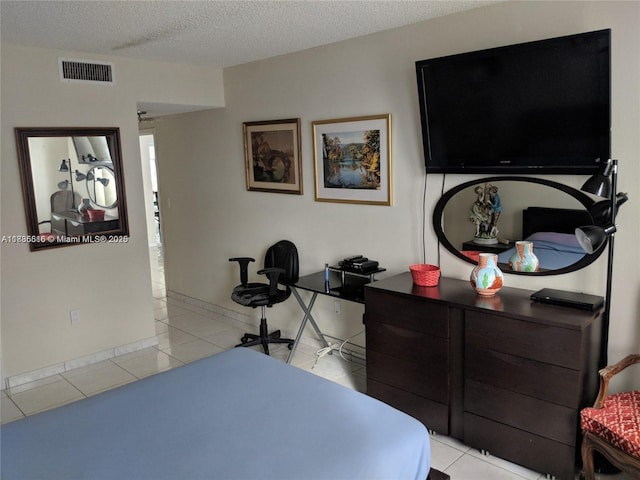 1980 S Ocean Dr Unit 15C, Hallandale Beach, FL 33009 - bedroom with light tile patterned floors, a textured ceiling, and a desk