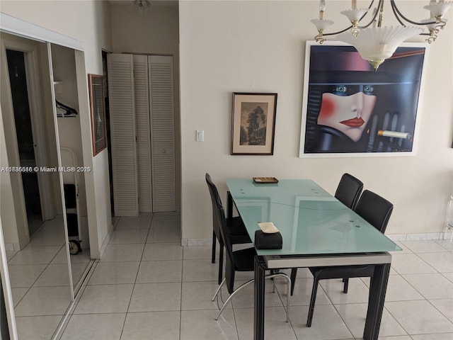 1980 S Ocean Dr Unit 15C, Hallandale Beach, FL 33009 - tiled dining room featuring a chandelier and baseboards