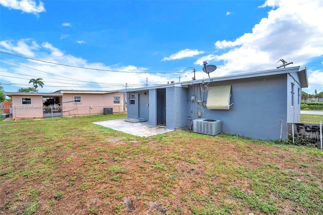 1408 9th St, West Palm Beach, FL 33401 - rear view of house with stucco siding and a patio