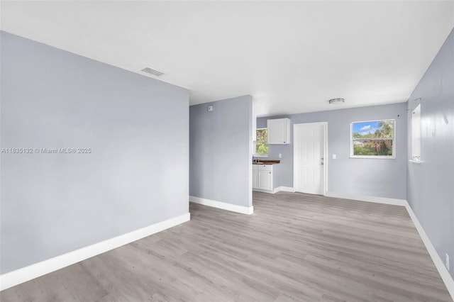 1408 9th St, West Palm Beach, FL 33401 - spare room with light wood-type flooring and healthy amount of natural light