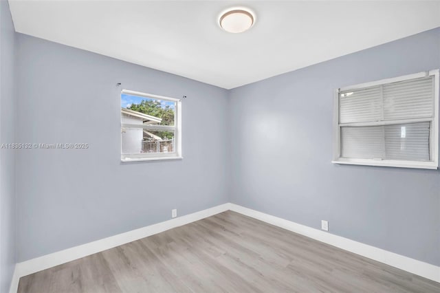 1408 9th St, West Palm Beach, FL 33401 - spare room with wood finished floors and baseboards