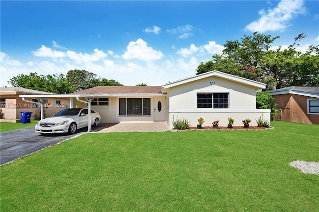 7051 SW 29th St, Miramar, FL 33023 - view of front facade featuring driveway, a front yard, and stucco siding