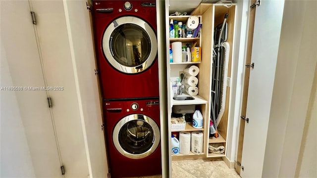 16400 Collins Ave Unit 841, Sunny Isles Beach, FL 33160 - laundry area with stacked washing machine and dryer and tile patterned floors