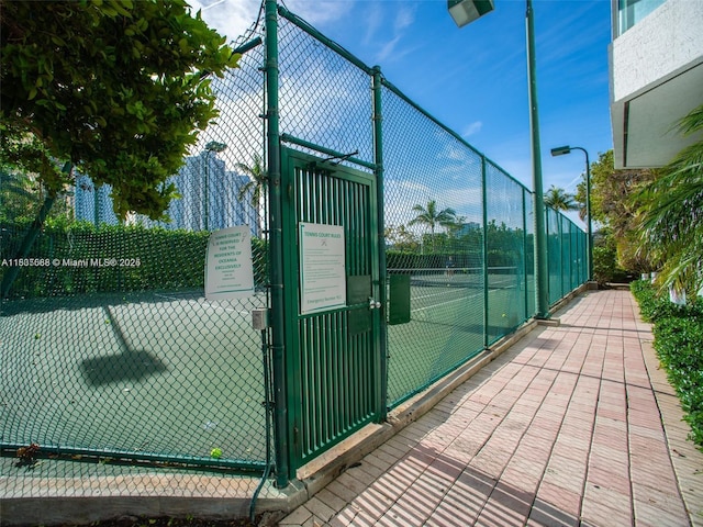 16400 Collins Ave Unit 841, Sunny Isles Beach, FL 33160 - view of tennis court featuring a gate