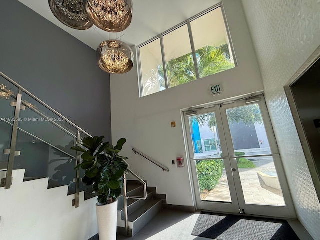 280 SW 20th Rd Unit 404, Miami, FL 33129 - entryway with a chandelier, stairs, french doors, and a high ceiling
