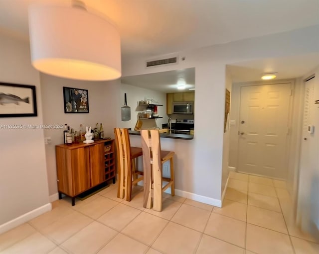 280 SW 20th Rd Unit 404, Miami, FL 33129 - corridor with light tile patterned flooring and baseboards