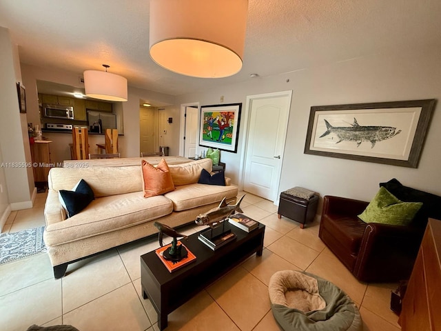 280 SW 20th Rd Unit 404, Miami, FL 33129 - living area with light tile patterned floors and a textured ceiling