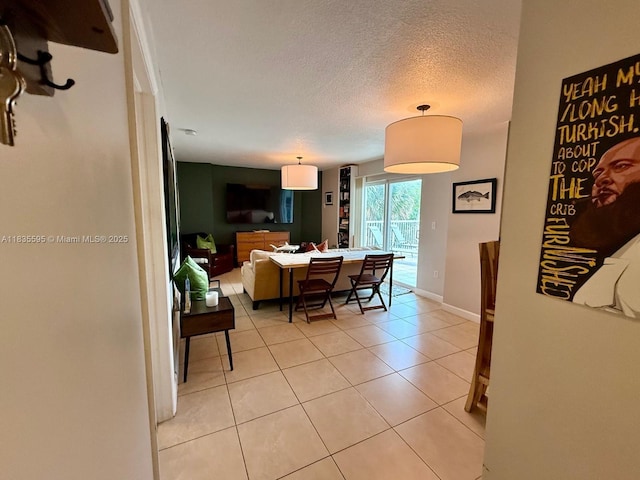 280 SW 20th Rd Unit 404, Miami, FL 33129 - living room with a textured ceiling and light tile patterned floors