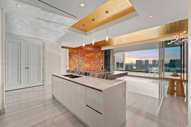 17901 S Collins Ave Unit 1506, Sunny Isles Beach, FL 33160 - kitchen featuring modern cabinets, white cabinets, a kitchen island with sink, recessed lighting, and light tile patterned floors