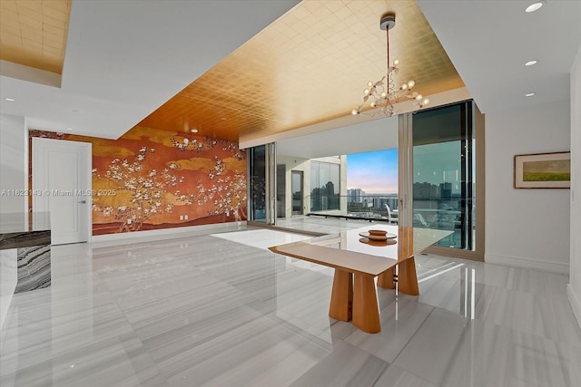 17901 S Collins Ave Unit 1506, Sunny Isles Beach, FL 33160 - unfurnished dining area featuring a chandelier, recessed lighting, floor to ceiling windows, and light tile patterned flooring