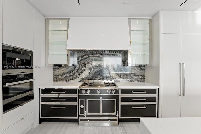 17901 S Collins Ave Unit 1506, Sunny Isles Beach, FL 33160 - kitchen with premium range hood, range with two ovens, tasteful backsplash, oven, and white cabinetry