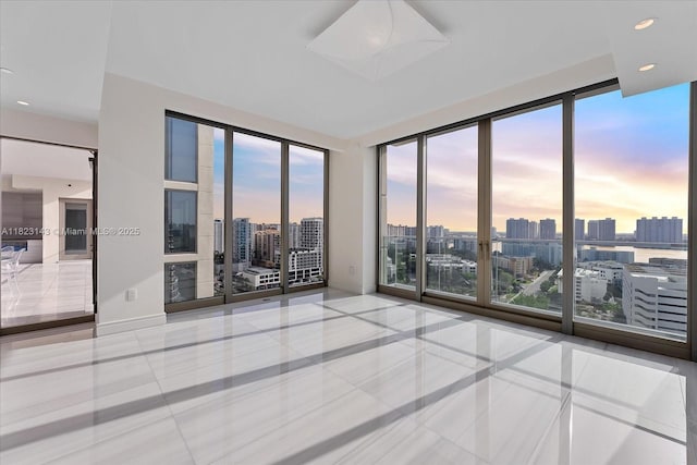 17901 S Collins Ave Unit 1506, Sunny Isles Beach, FL 33160 - spare room with a skyline view and tile patterned floors
