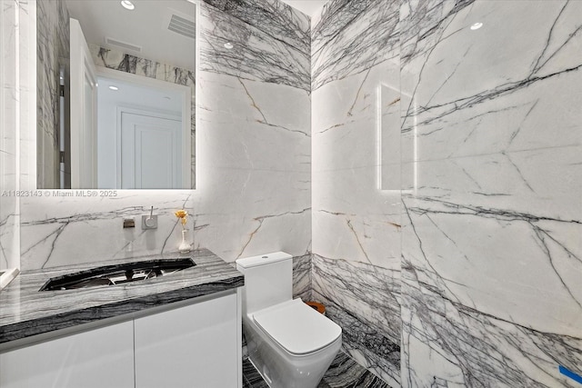 17901 S Collins Ave Unit 1506, Sunny Isles Beach, FL 33160 - bathroom featuring tile walls, vanity, and marble finish floors