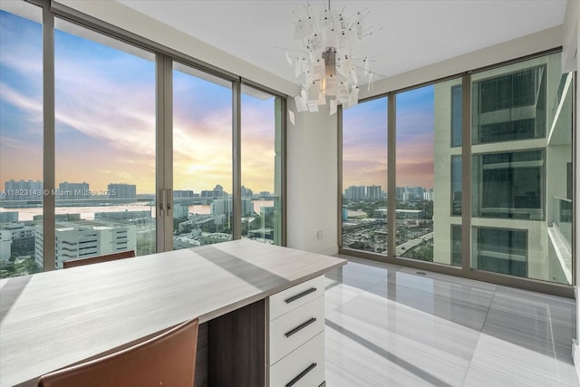 17901 S Collins Ave Unit 1506, Sunny Isles Beach, FL 33160 - kitchen featuring a view of city, modern cabinets, white cabinets, a chandelier, and tile patterned flooring