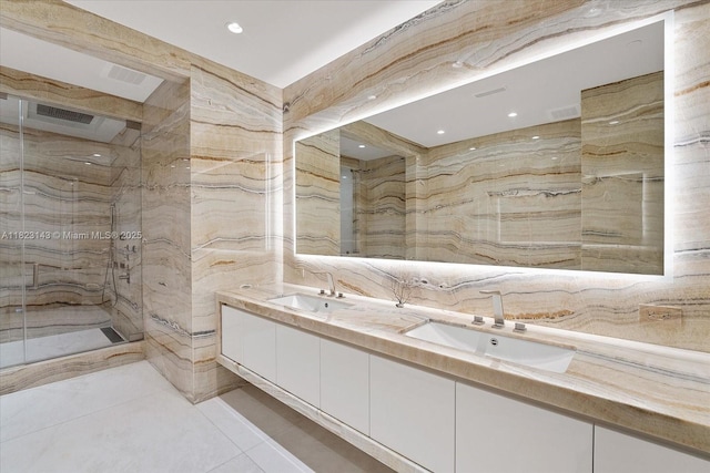 17901 S Collins Ave Unit 1506, Sunny Isles Beach, FL 33160 - bathroom featuring double vanity, a marble finish shower, recessed lighting, and tile patterned flooring