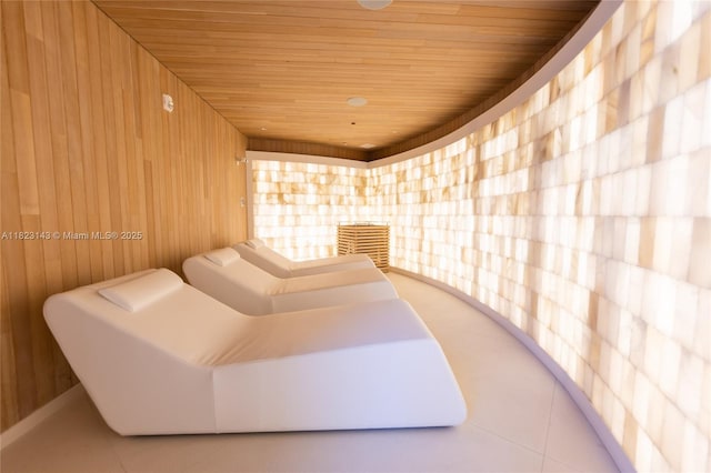 17901 S Collins Ave Unit 1506, Sunny Isles Beach, FL 33160 - relaxing sauna with wood ceiling, tile patterned flooring, and wood walls