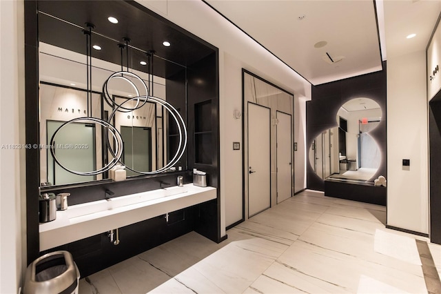 17901 S Collins Ave Unit 1506, Sunny Isles Beach, FL 33160 - full bath with double vanity, marble finish flooring, and recessed lighting