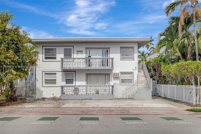 1334 Euclid Ave Unit 4, Miami Beach, FL 33139 - view of property with stairs, a balcony, and stucco siding