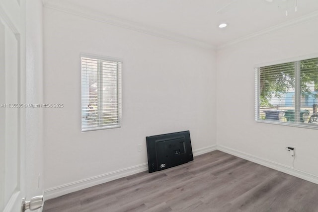 1941 NW 151st St, Miami Gardens, FL 33054 - unfurnished room with ornamental molding, plenty of natural light, wood finished floors, and recessed lighting