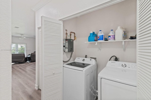 1941 NW 151st St, Miami Gardens, FL 33054 - laundry area with separate washer and dryer, wood finished floors, water heater, and ceiling fan