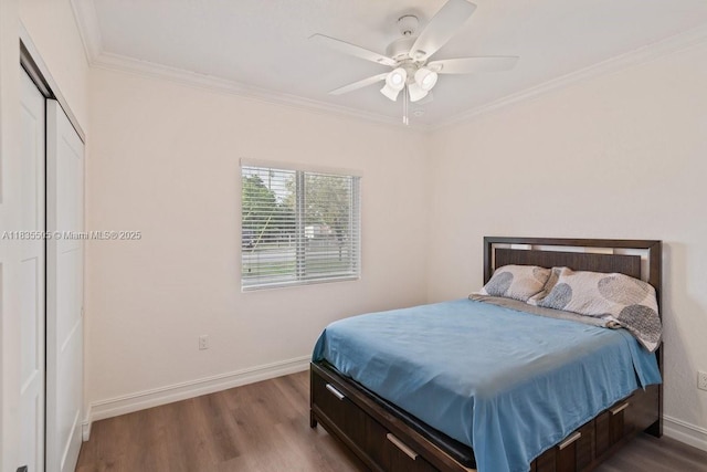 1941 NW 151st St, Miami Gardens, FL 33054 - bedroom with dark wood-type flooring, ornamental molding, a ceiling fan, and a closet