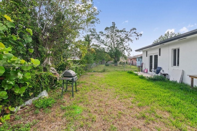 1941 NW 151st St, Miami Gardens, FL 33054 - view of yard featuring french doors