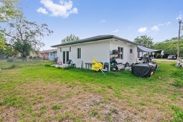 1941 NW 151st St, Miami Gardens, FL 33054 - back of property featuring french doors and stucco siding