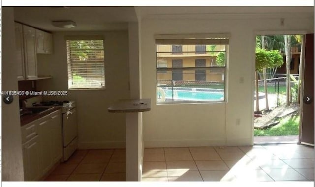 3901 SW 112th Ave Unit 25, Miami, FL 33165 - entryway featuring plenty of natural light and light tile patterned flooring