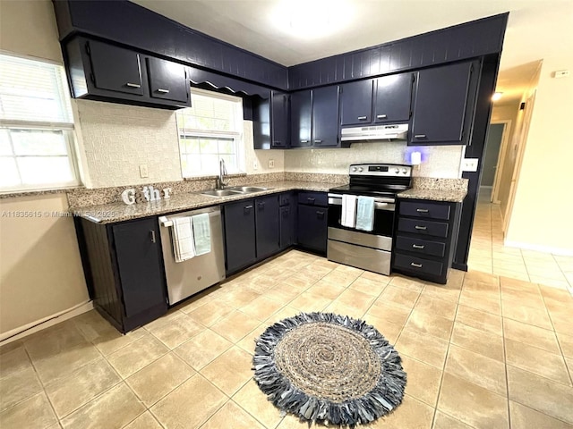 1148 N Singleton Ave, Titusville, FL 32796 - kitchen featuring appliances with stainless steel finishes, under cabinet range hood, light tile patterned flooring, dark cabinets, and backsplash