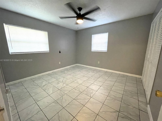 1148 N Singleton Ave, Titusville, FL 32796 - unfurnished bedroom featuring a textured ceiling, a closet, and ceiling fan