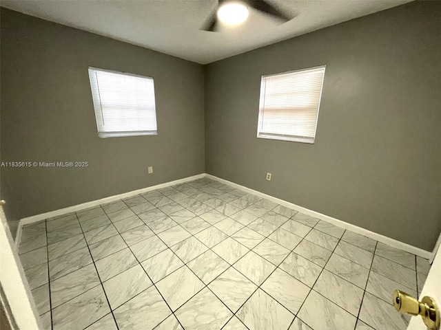 1148 N Singleton Ave, Titusville, FL 32796 - unfurnished room with light marble finish flooring and a ceiling fan