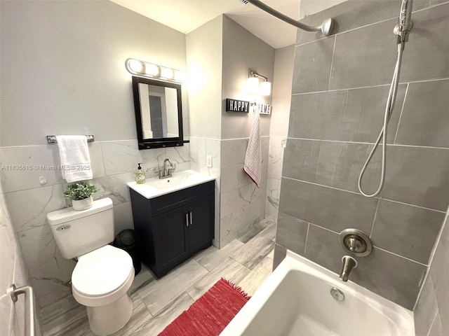 1148 N Singleton Ave, Titusville, FL 32796 - bathroom featuring tile walls, vanity, tub / shower combination, and wainscoting