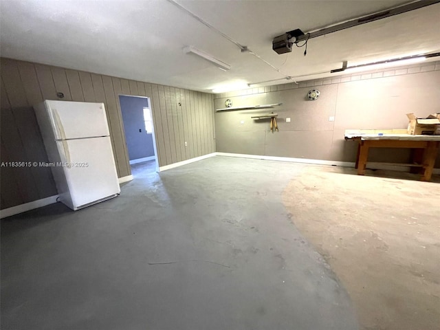 1148 N Singleton Ave, Titusville, FL 32796 - garage featuring freestanding refrigerator and a garage door opener