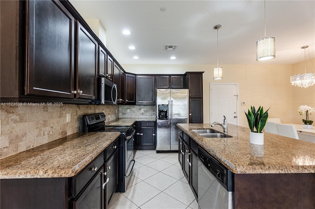 4375 Cascada Cir, Cooper City, FL 33024 - kitchen with appliances with stainless steel finishes, decorative backsplash, light tile patterned floors, decorative light fixtures, and light stone counters