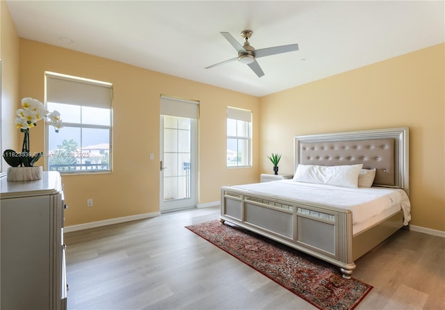 4375 Cascada Cir, Cooper City, FL 33024 - bedroom featuring light wood-type flooring, multiple windows, and a ceiling fan