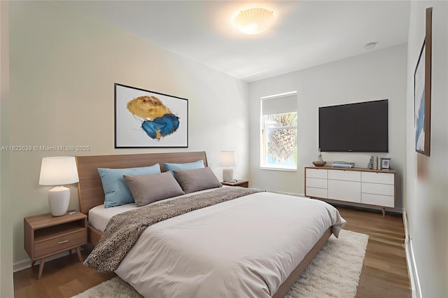 4375 Cascada Cir, Cooper City, FL 33024 - bedroom featuring wood finished floors and baseboards