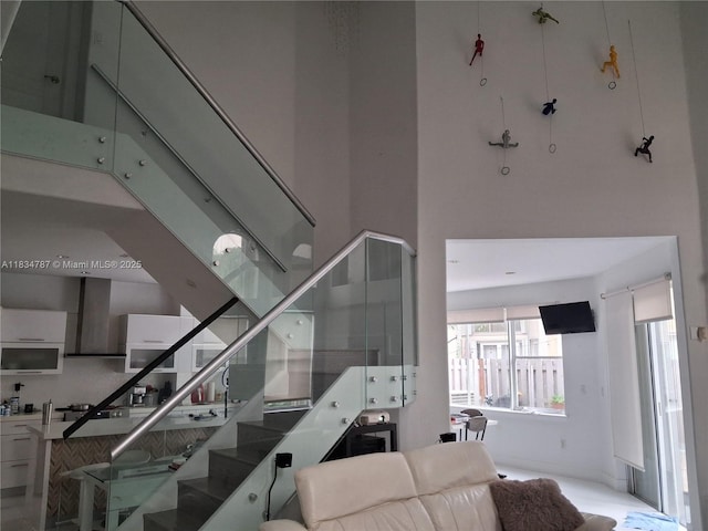 5490 NW 113th Ct, Doral, FL 33178 - staircase featuring a high ceiling