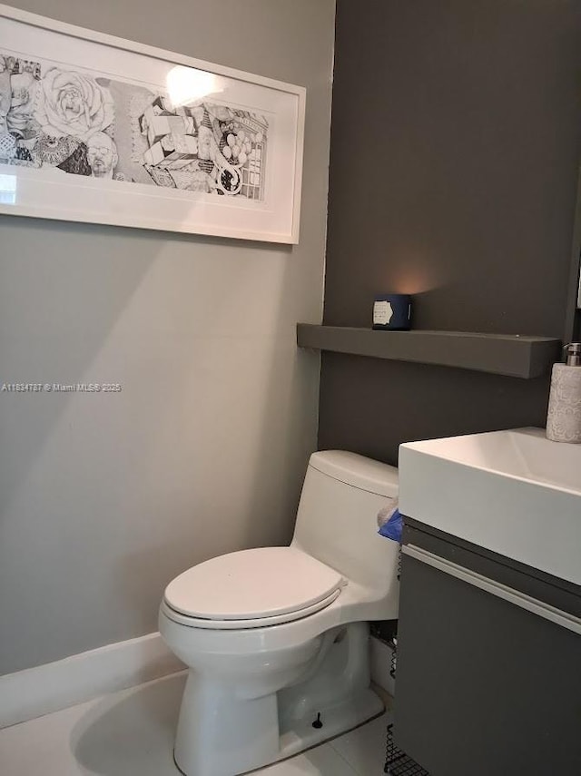5490 NW 113th Ct, Doral, FL 33178 - half bathroom featuring vanity and tile patterned flooring