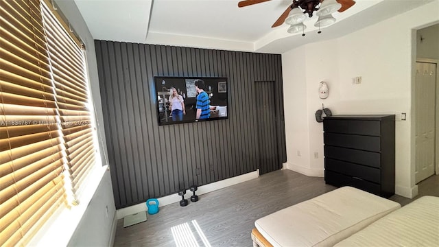 5490 NW 113th Ct, Doral, FL 33178 - bedroom with wood finished floors, ceiling fan, and a tray ceiling