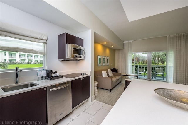 5300 NW 87th Ave Unit 1201, Doral, FL 33178 - kitchen featuring stainless steel appliances, light countertops, dark brown cabinetry, modern cabinets, and light tile patterned flooring
