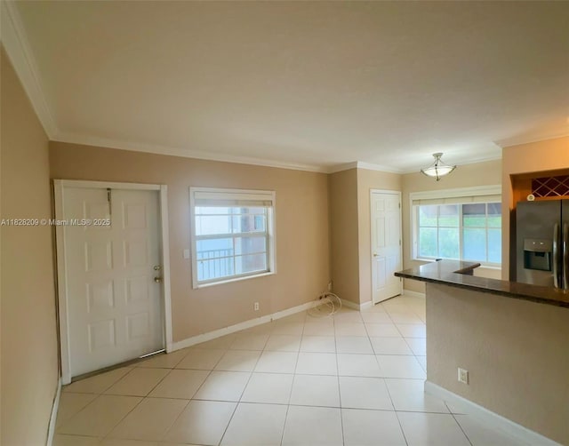 924 SE 2nd St Unit 9, Fort Lauderdale, FL 33301 - unfurnished living room featuring crown molding and light tile patterned floors